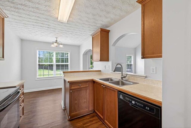563 Bailey Dr, Jefferson, GA 30549 - kitchen featuring black appliances, arched walkways, light countertops, and dark wood-style flooring