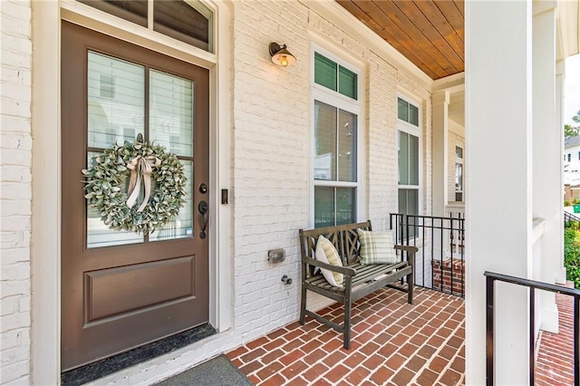 1964 Attell Way, Decatur, GA 30033 - view of exterior entry featuring a porch and brick siding