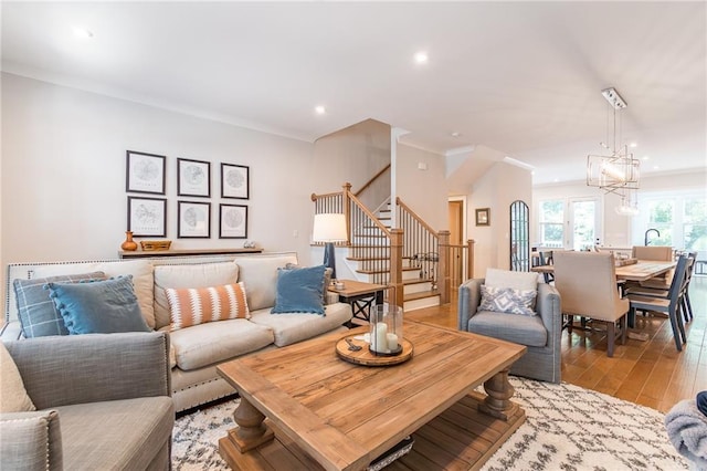 1964 Attell Way, Decatur, GA 30033 - living room featuring stairs, light wood finished floors, crown molding, recessed lighting, and a chandelier