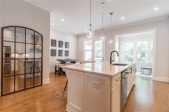 1964 Attell Way, Decatur, GA 30033 - kitchen with a sink, stainless steel appliances, a center island with sink, light wood-style floors, and baseboards