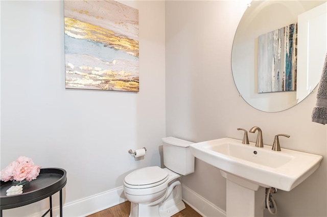 1964 Attell Way, Decatur, GA 30033 - bathroom featuring baseboards, toilet, wood finished floors, and a sink