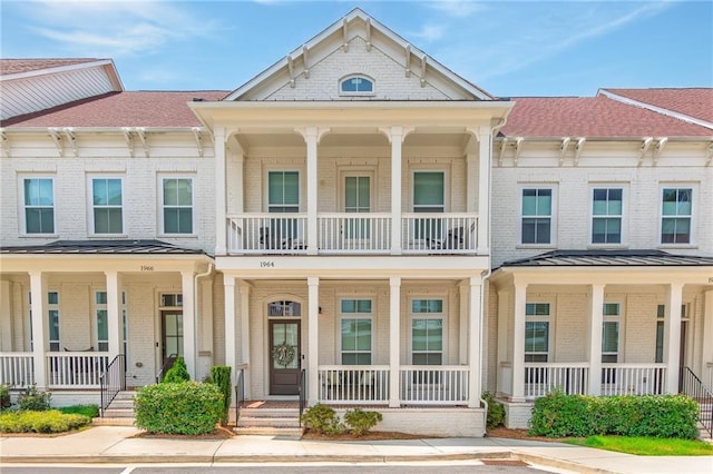 1964 Attell Way, Decatur, GA 30033 - view of property with covered porch, brick siding, and a standing seam roof