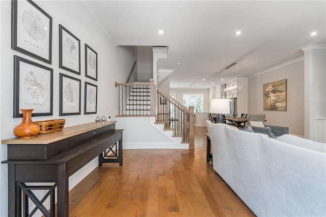 1964 Attell Way, Decatur, GA 30033 - living room featuring stairway, wood-type flooring, crown molding, a chandelier, and recessed lighting