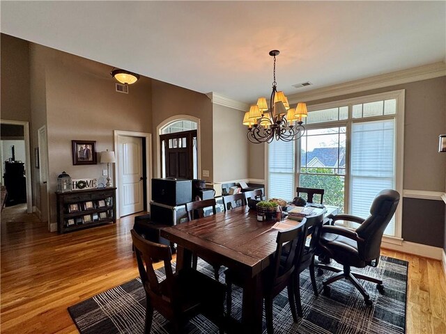 living room with a fireplace, high vaulted ceiling, a ceiling fan, and wood finished floors