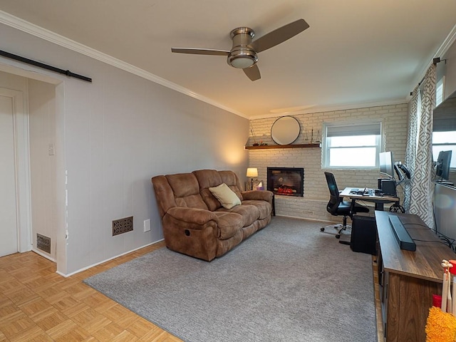 living room featuring crown molding, brick wall, ceiling fan, light parquet flooring, and a fireplace