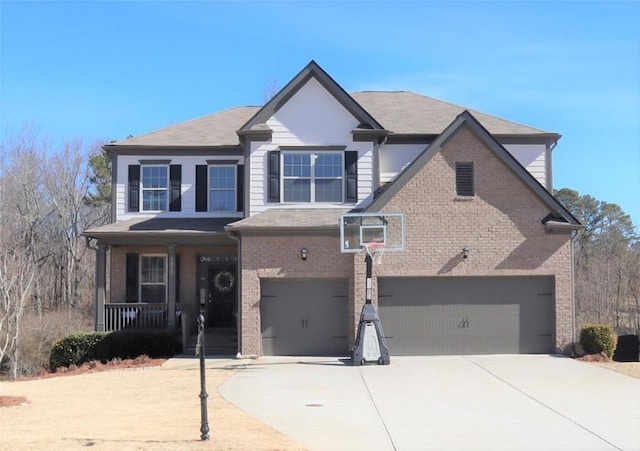 view of front of property featuring a garage, a porch, concrete driveway, and brick siding