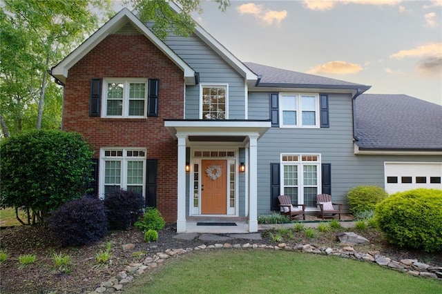 4130 Providnce Sq, Alpharetta, GA 30009 - view of front of home featuring an attached garage, brick siding, and roof with shingles