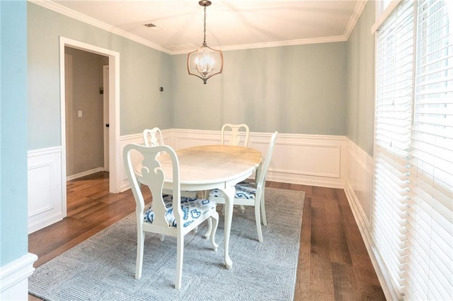 4130 Providnce Sq, Alpharetta, GA 30009 - dining area with dark wood-style floors, a wainscoted wall, crown molding, a chandelier, and a decorative wall