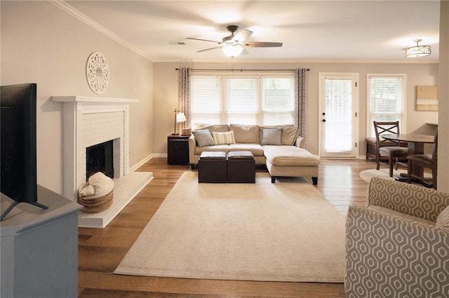 4130 Providnce Sq, Alpharetta, GA 30009 - living room featuring ornamental molding, ceiling fan, plenty of natural light, wood finished floors, and baseboards