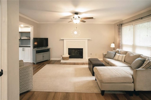 4130 Providnce Sq, Alpharetta, GA 30009 - living area with ceiling fan, ornamental molding, dark wood-type flooring, a brick fireplace, and baseboards
