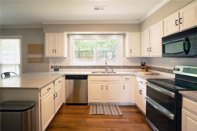4130 Providnce Sq, Alpharetta, GA 30009 - kitchen featuring stainless steel appliances, a sink, a peninsula, dark wood-style flooring, and tasteful backsplash