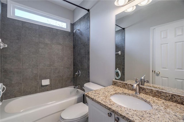 full bathroom featuring vanity, toilet, and tiled shower / bath combo