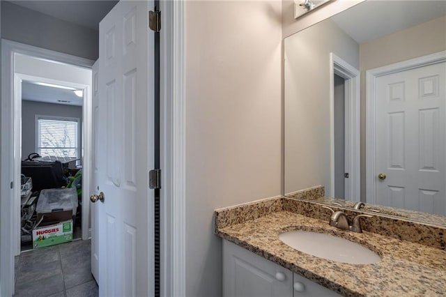 bathroom featuring tile patterned floors and vanity