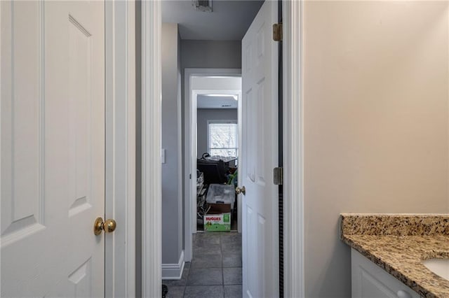 bathroom with vanity and tile patterned floors