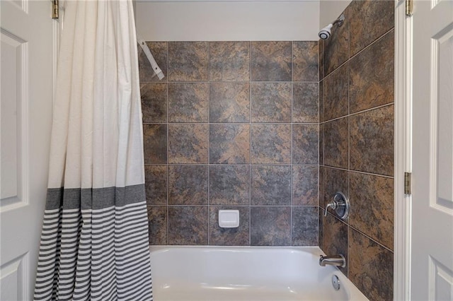 bathroom featuring shower / bath combo with shower curtain