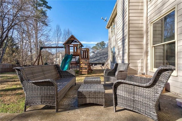 view of patio with outdoor lounge area and a playground