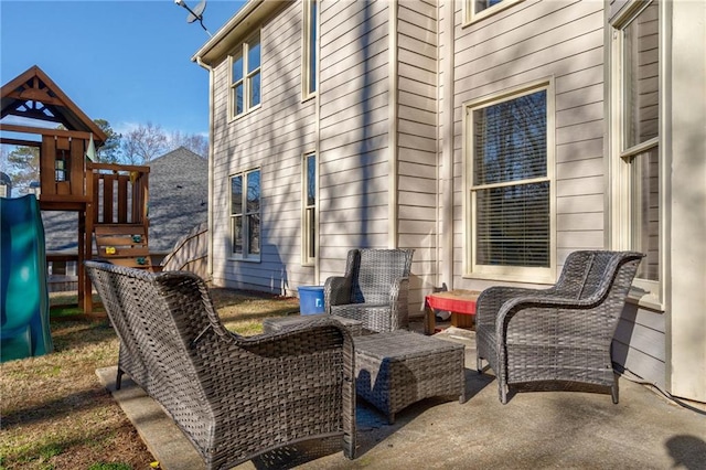 view of patio / terrace with a playground and an outdoor living space