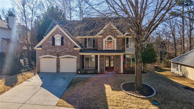 view of front of home featuring a garage, a front lawn, and a porch