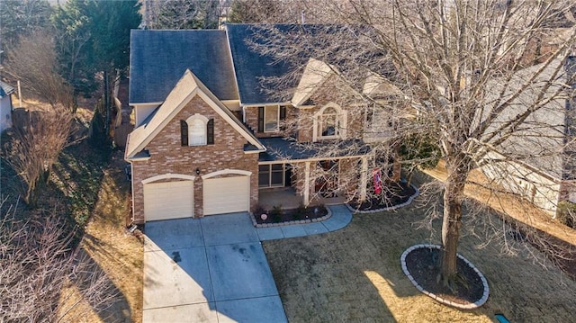 view of front of property with a garage and a front yard