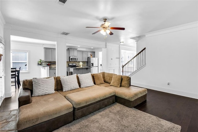 908 Rainsong Ct, Braselton, GA 30517 - living room featuring ornamental molding, a ceiling fan, stairs, and dark wood-style flooring