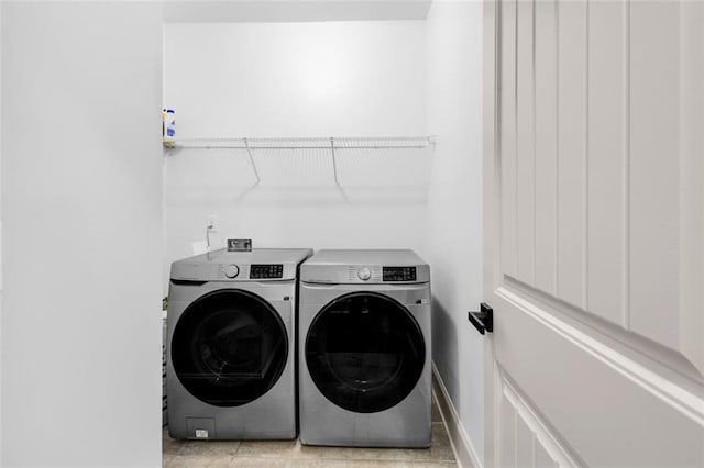 908 Rainsong Ct, Braselton, GA 30517 - laundry area with washing machine and dryer and baseboards