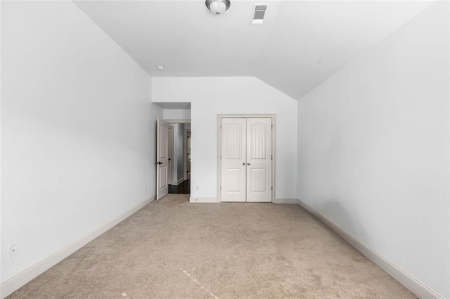 908 Rainsong Ct, Braselton, GA 30517 - unfurnished bedroom with lofted ceiling, carpet flooring, and a closet