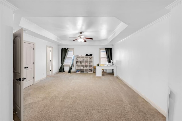 908 Rainsong Ct, Braselton, GA 30517 - unfurnished living room with a tray ceiling, a ceiling fan, carpet floors, and ornamental molding