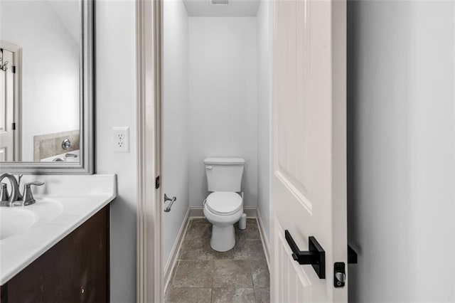 908 Rainsong Ct, Braselton, GA 30517 - bathroom featuring vanity and stone finish flooring