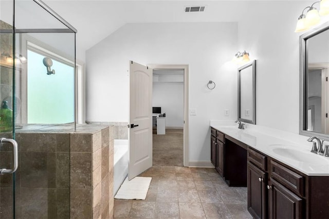 908 Rainsong Ct, Braselton, GA 30517 - bathroom featuring double vanity, lofted ceiling, a bath, and a tile shower