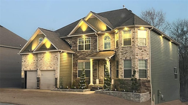 908 Rainsong Ct, Braselton, GA 30517 - craftsman-style home with driveway, stone siding, and roof with shingles