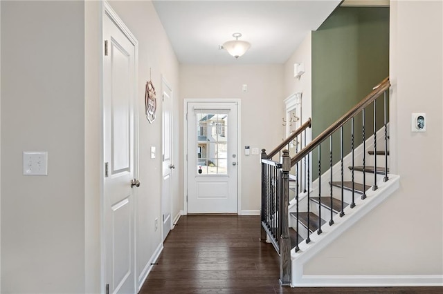 entryway with dark hardwood / wood-style floors