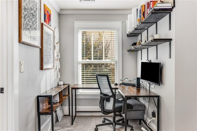 office featuring visible vents, baseboards, light colored carpet, and ornamental molding