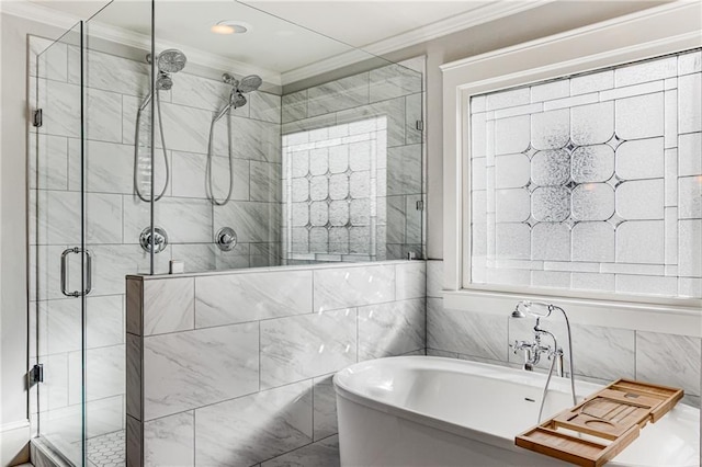 bathroom featuring a freestanding bath, tile walls, a stall shower, and ornamental molding