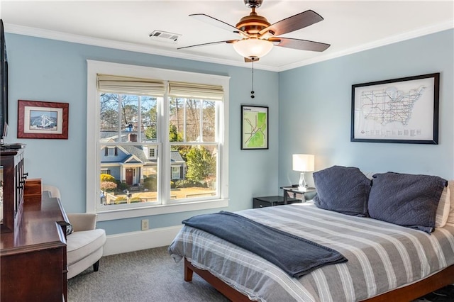 bedroom featuring baseboards, visible vents, carpet floors, ceiling fan, and ornamental molding