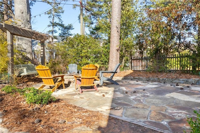 view of patio / terrace featuring fence