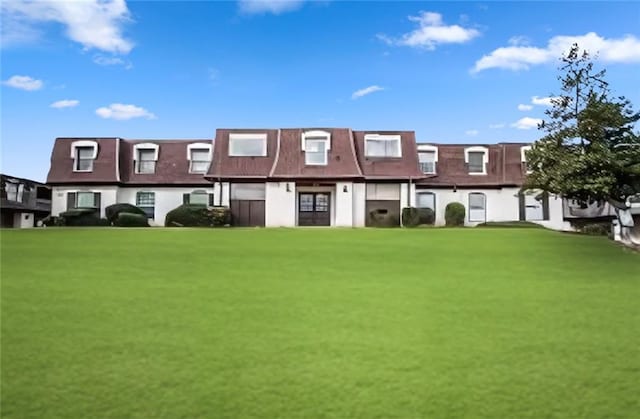 12 Rue Fontaine, Lithonia, GA 30038 - view of front facade with a front lawn and stucco siding