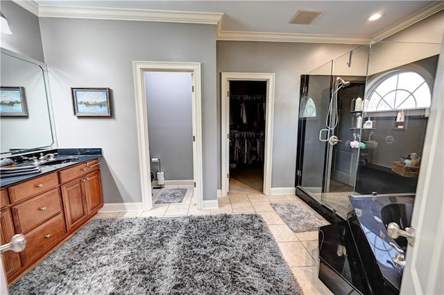 bathroom featuring ornamental molding, vanity, plus walk in shower, and tile patterned flooring