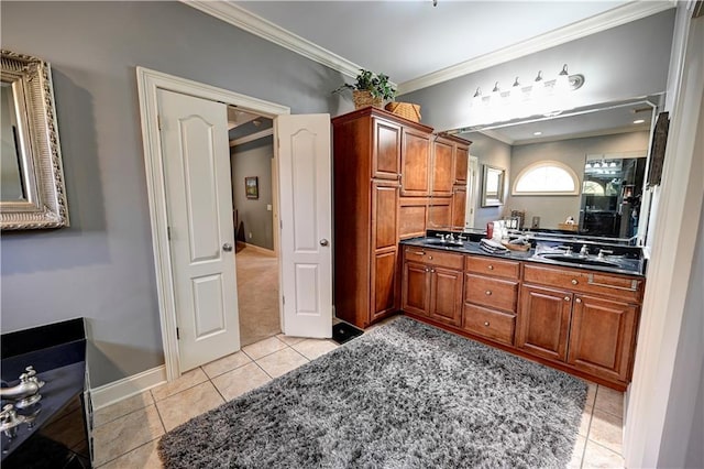 bathroom featuring tile patterned flooring, vanity, and ornamental molding