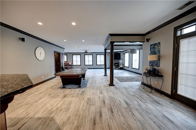 recreation room featuring light wood-type flooring, pool table, decorative columns, and ornamental molding