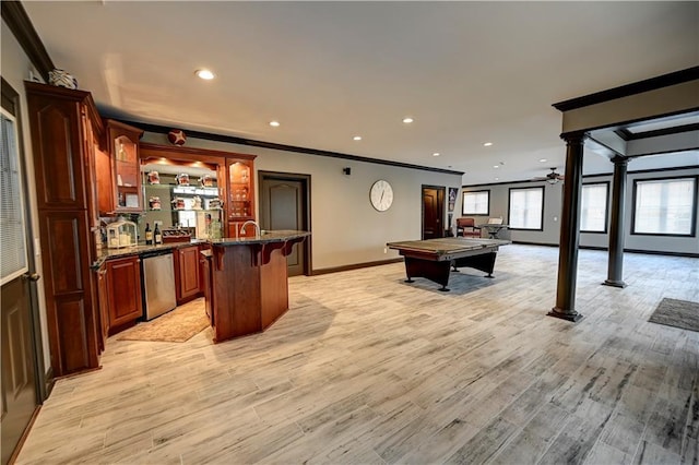 game room featuring ornate columns, crown molding, light hardwood / wood-style flooring, bar area, and pool table