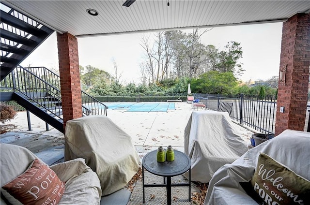 view of patio featuring a grill and a covered pool