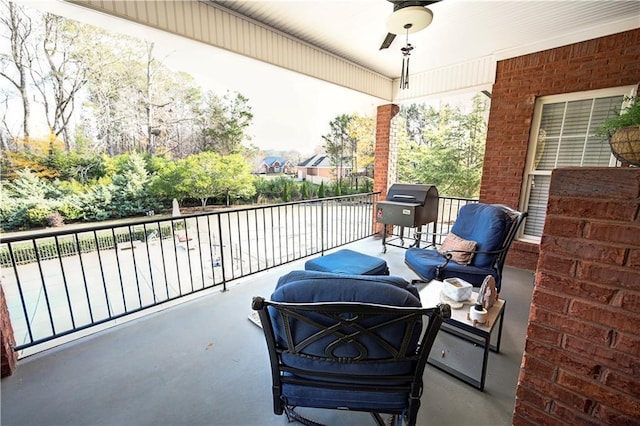 balcony with ceiling fan and a grill