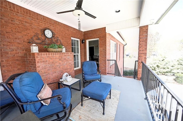 exterior space featuring ceiling fan and a balcony