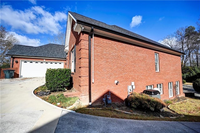 view of side of property with a garage