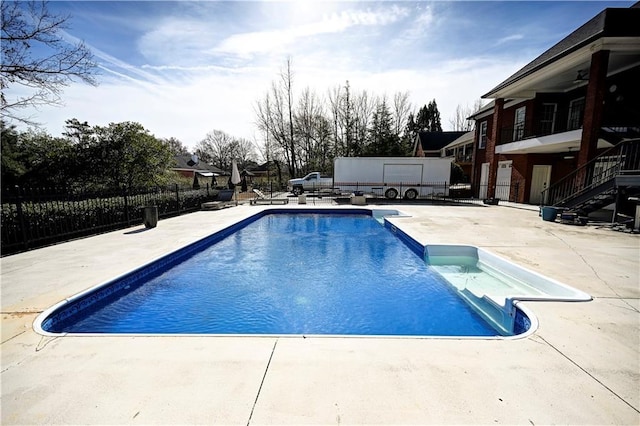 view of swimming pool featuring a patio