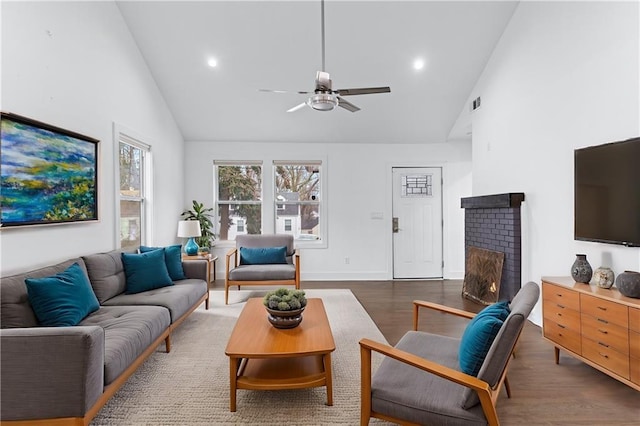 living room featuring high vaulted ceiling, dark wood-type flooring, and ceiling fan