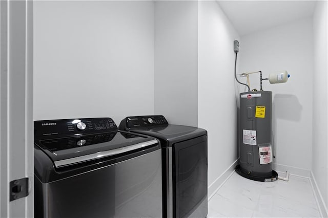 laundry area with washing machine and dryer and electric water heater