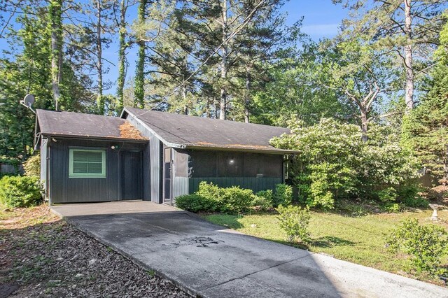 view of side of home featuring a yard
