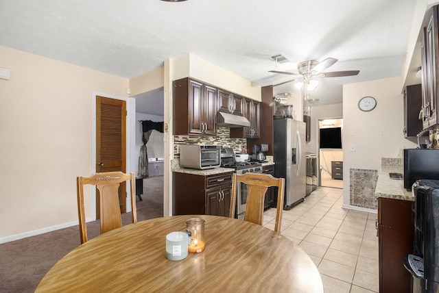 kitchen featuring under cabinet range hood, appliances with stainless steel finishes, dark brown cabinetry, and a ceiling fan