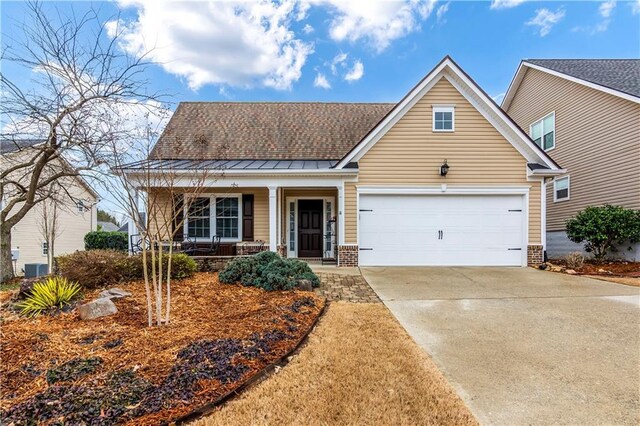 view of front of house featuring covered porch and a garage